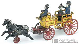 Ward Kimball collected toys as well as trains. In the cast-iron category is this Happy Hooligan Police Patrol wagon. As the toy moves, the policeman whacks the hapless Hooligan