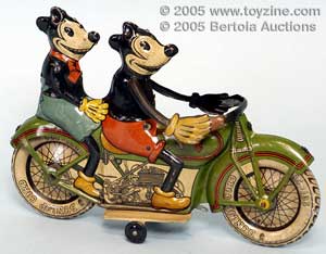 Mickey Mouse takes Minnie for a ride on a beautiful Tippco. motorcycle in enviable condition