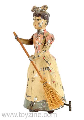 Female with Broom Mechanical Tin Toy